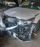 Front-end collision damage to a client vehicle